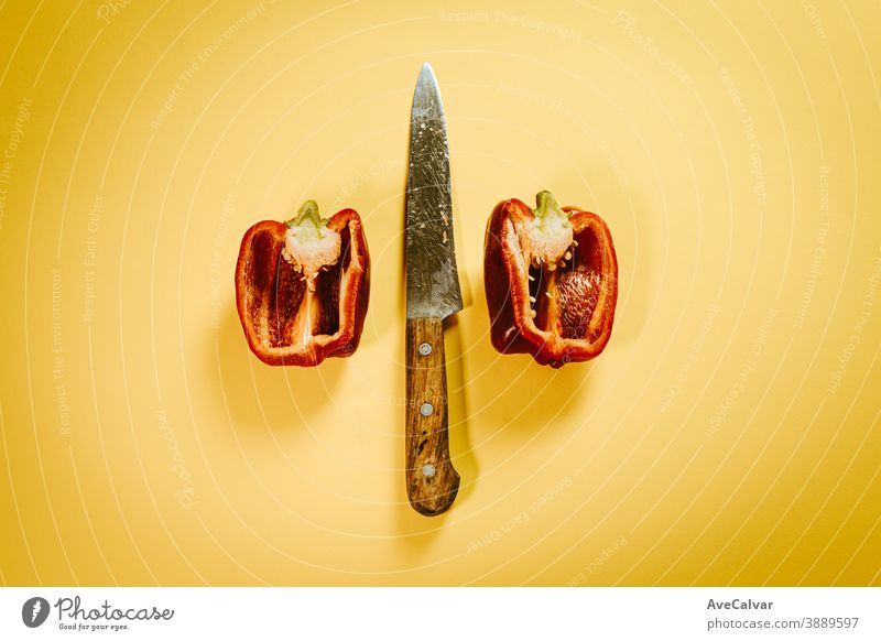 A knife in the middle of a cut bell pepper Fresh Organic Food background Vegetable vegetarian Component Healthy Nature Quality Restaurant Knives haute cuisine