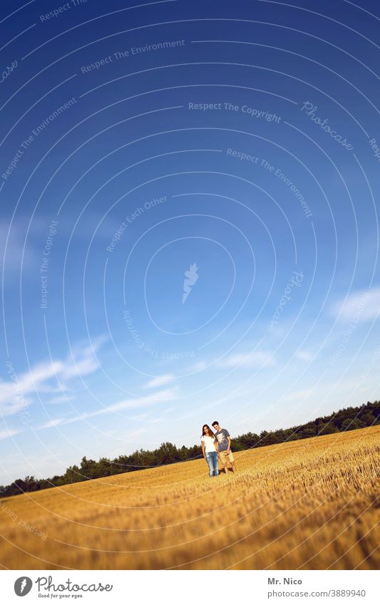 Young couple standing on stubble field Stubble field Field Nature Harvest Agriculture Landscape Summer Sky Couple Sympathy Beautiful weather In love Together