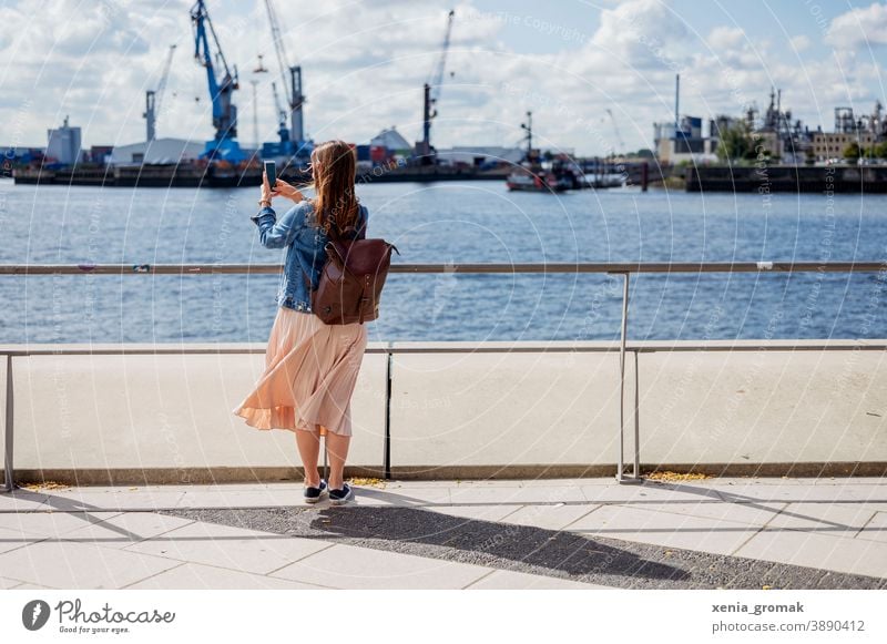 Woman taking a photo in the harbor Hamburg Port of Hamburg Harbour Port City Lifestyle Town Navigation Tourist Attraction social media content Tourism Downtown