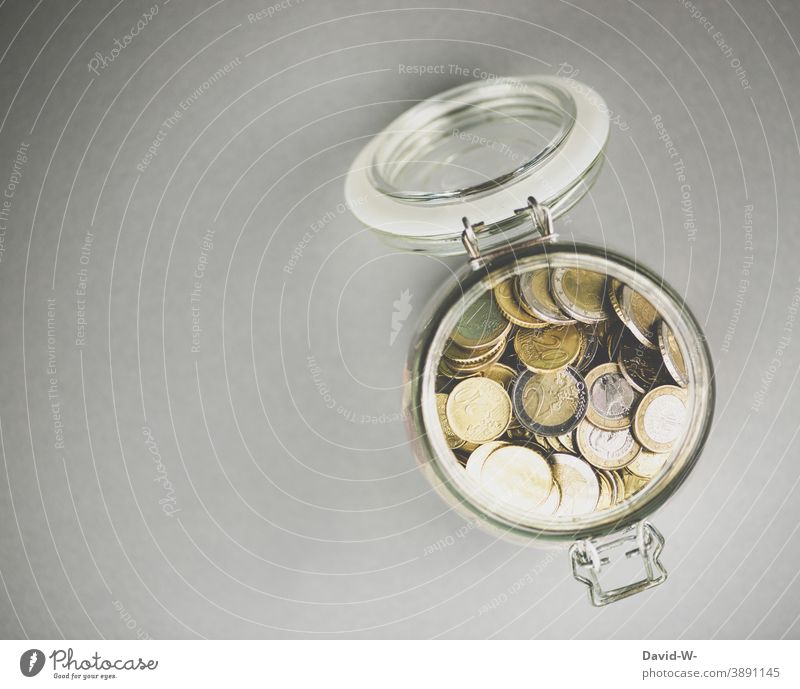 Savings in a jar Euro Coins € Save Poverty savings Money Loose change