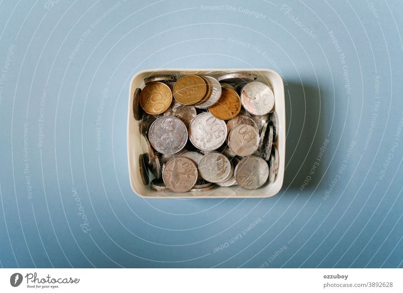 indonesian rupiah coins on white box Coin Box Money Money box Save Colour photo Financial Industry Thrifty Financial institution Economy Business Income