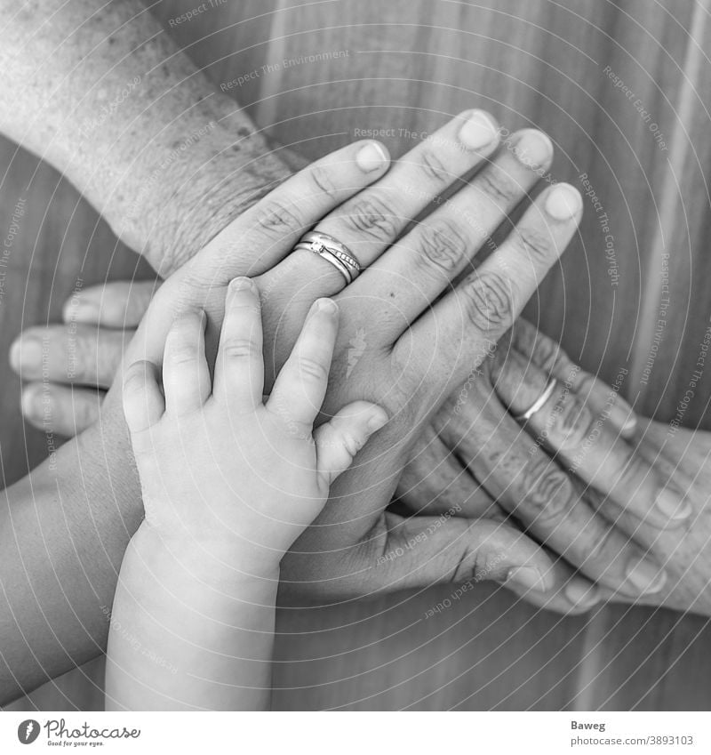 Hands of four generations old age baby parents family finger woman joy former times community luck grandmother hand hands child power love closeup newborn