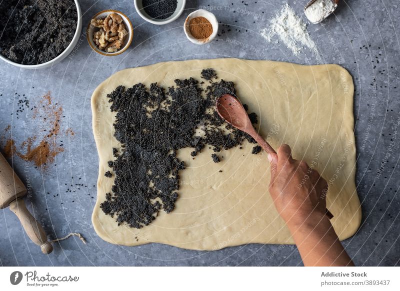 Person preparing buns with poppy seeds pastry sweet dough prepare make food ingredient kitchen cook homemade culinary recipe cuisine meal process hand