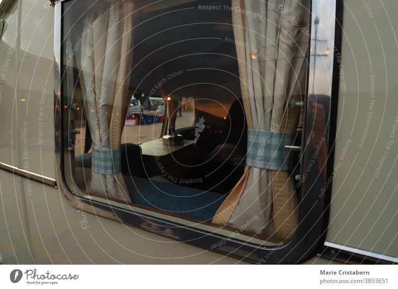 Close up of an RV or motor home showing concept of life in the road, alternative lifestyle and travel rv travel lifestyle rv window van life vehicle modern