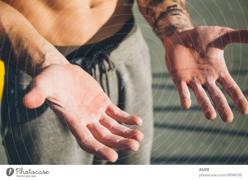 Hands with callus of a young calisthenics sportman hands callosity hardness magnesium powder chalk athlete muscles strength gymnastics street freestyle body