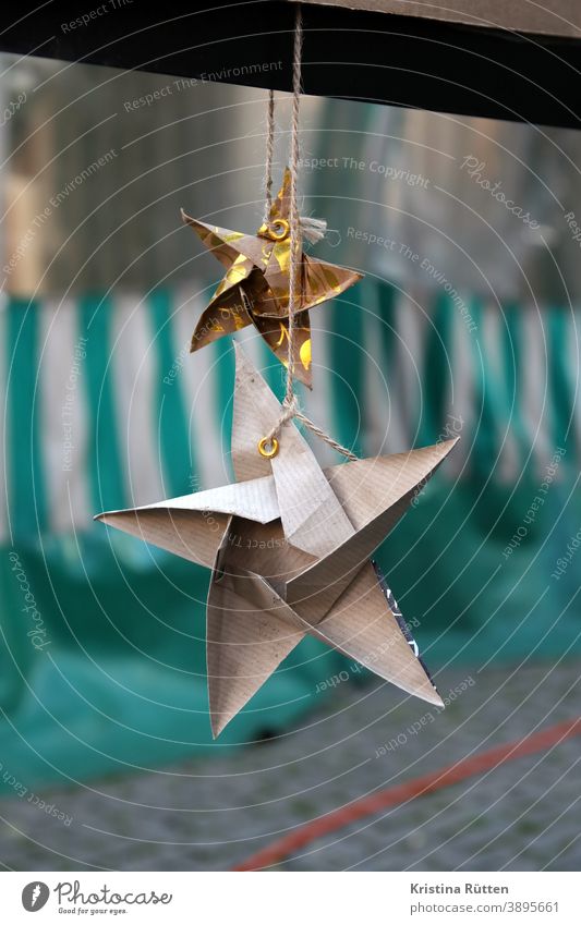 homemade paper stars as decoration at market stall Stars christmas ornaments christmas decoration Christmassy Origami self-made Home-made Handicraft Markets