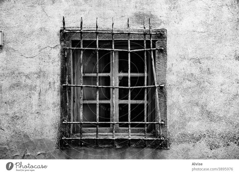 window with white grille grunge old vintage architecture wall background aged metal exterior dirty texture building retro ancient house facade construction