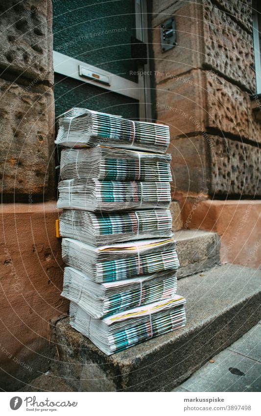 Daily newspaper batch ready for delivery banker Cash dax dollar dow jones finance fonds Hang-Seng hedge fond invest investment management money Nikkei stock