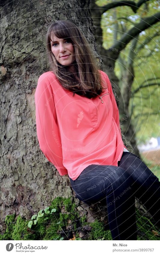 young woman standing reservedly by a tree portrait Woman Feminine Environment Nature Tree Long-haired Brunette Joie de vivre (Vitality) Sympathy naturally