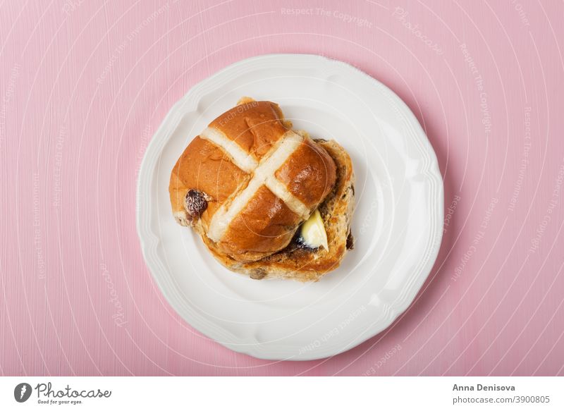 Easter Breakfast with Hot Cross Buns hot cross bun easter bread butter food traditional sweet fresh white holiday wooden celebration cake baked treat view
