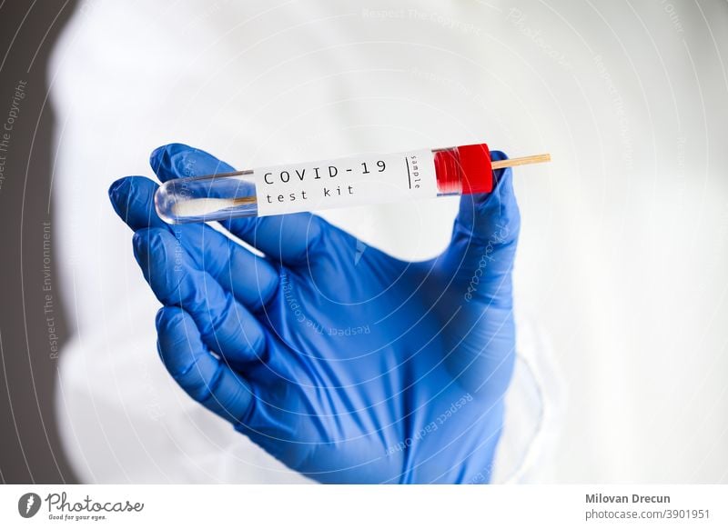 COVID-19 virus disease self swab test sample kit, medical laboratory scientist holding a test tube with throat swab viral specimen collection equipment, Coronavirus health check