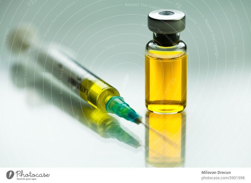 Syringe with needle & vial ampoule with yellow liquid,illustration of potential vaccine for Coronavirus,groundbreaking cure & therapy for COVID-19 virus disease,SARS-CoV-2 remedy & immunization,W.H.O.