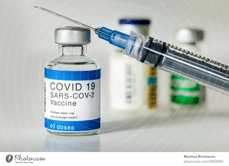 Concept fight against virus covid-19 corona virus, doctor or scientist in laboratory holding a syringe with liquid vaccines. Concept:diseases,medical care,science