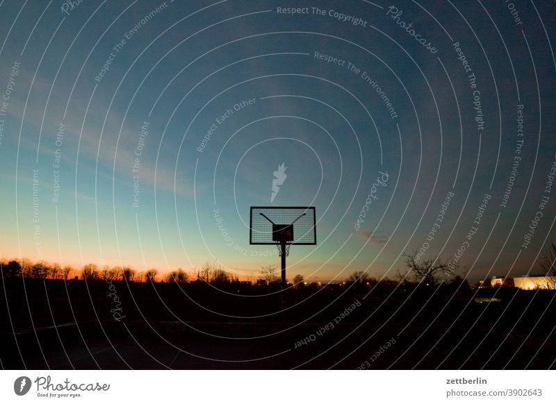 Basketball hoop in the evening Evening Ball game Dark Twilight somber colour spectrum Closing time Worm's-eye view Sky background Climate Climate change