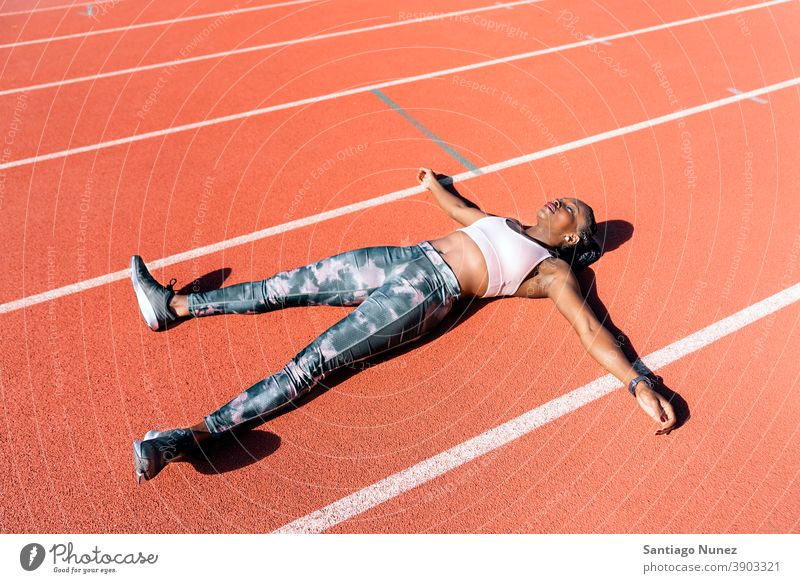Athlete sprinter lying down starting race competition athlete athletics competitive ready line beginnings compete competitor olympic olympics run sports women