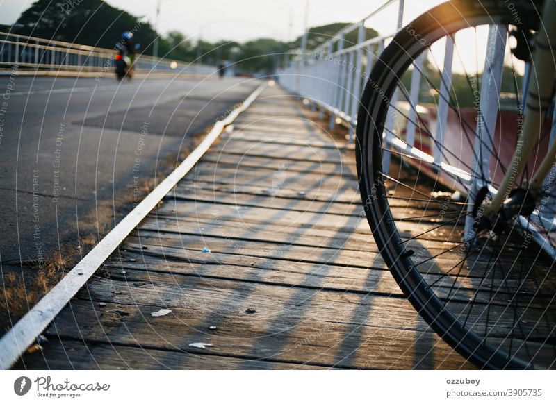 close up of bicycle wheel on side of bridge Bicycle Wheel Side Transport Cycling Day Means of transport Colour photo Parking motion active bike tire biking ride