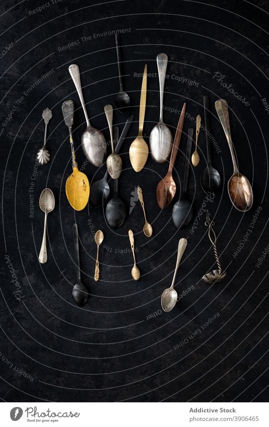 Collection of assorted spoons on table retro collection old fashioned set utensil various vintage silverware metal nostalgia rustic simple cutlery design