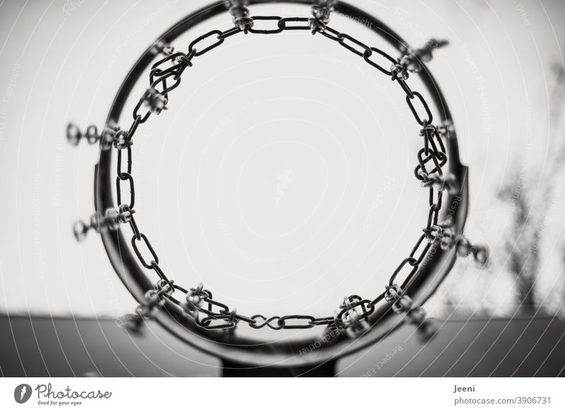 Basketball hoop from below in black and white against light background | metal frame and chains Basketball arena Metal Chain Chain link Framework
