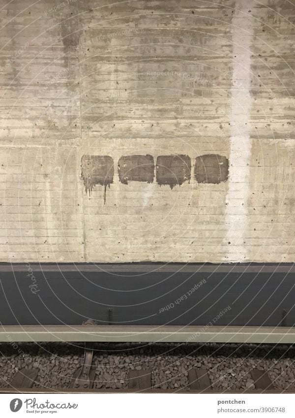 A track at a subway station. Grey tristesse Underground Train station Transport Gray dreariness Concrete Wall (barrier) Symmetry Station Mobility Climate change