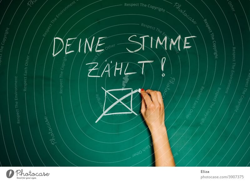 Go vote, because your vote counts. Woman makes a cross on a blackboard. choice Select Crucifix Vote policy German federal elections Election campaign Decide