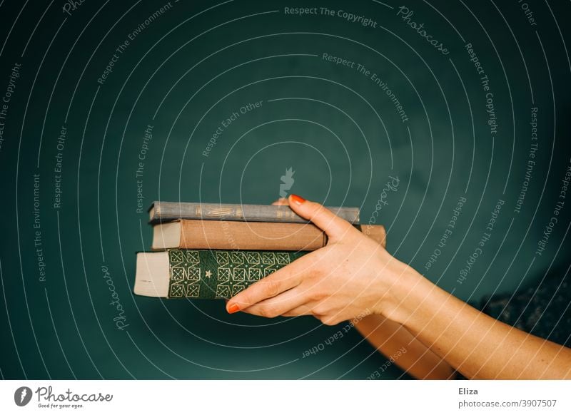 Woman holding a stack of books Stack Study Reading Give hand reading Literature Education Library Reading matter Book Novel Old book collection Green hands