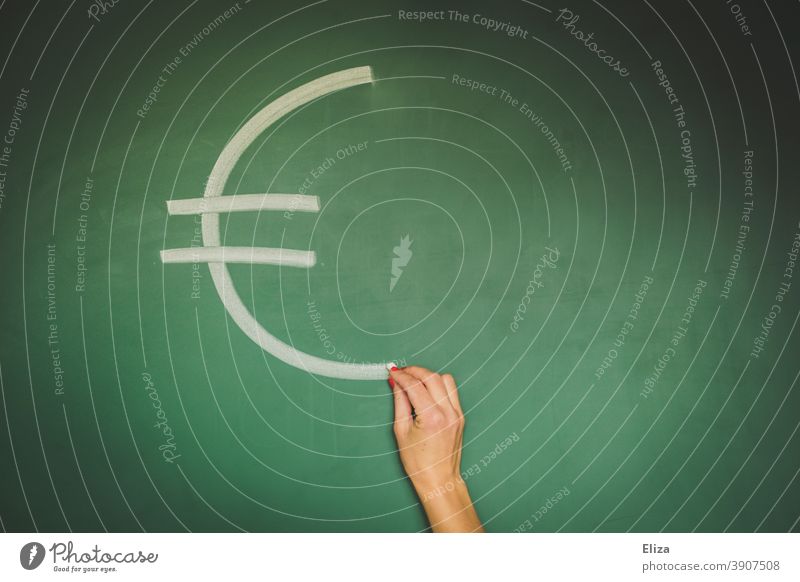 Hand paints euro symbol on blackboard Euro Money finance Euro symbol Financial Industry School Blackboard currency