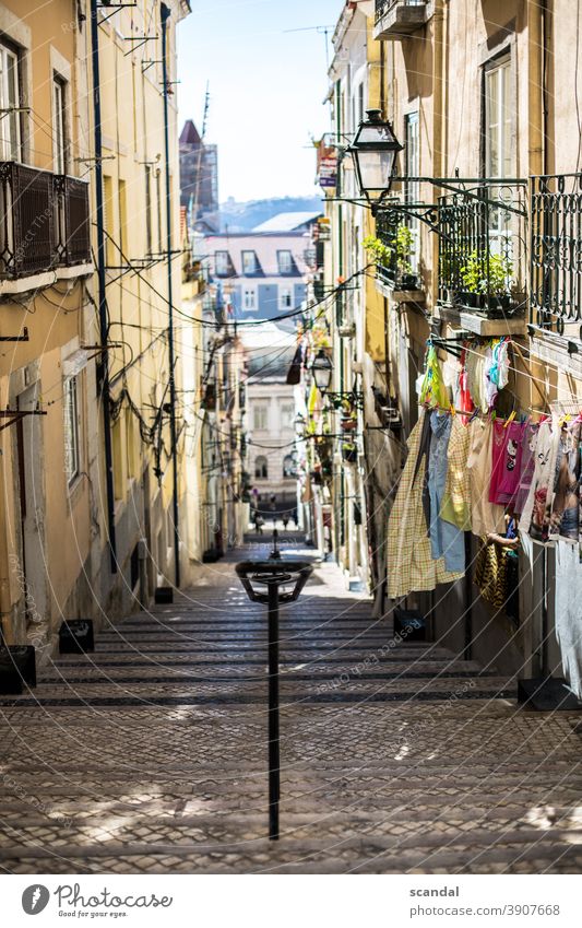 mediterranean street with sky and laundry Mediterranean Street Portugal Lisbon Laundry leash Sky off Cable Terminal connector Lantern daylight Day stagger