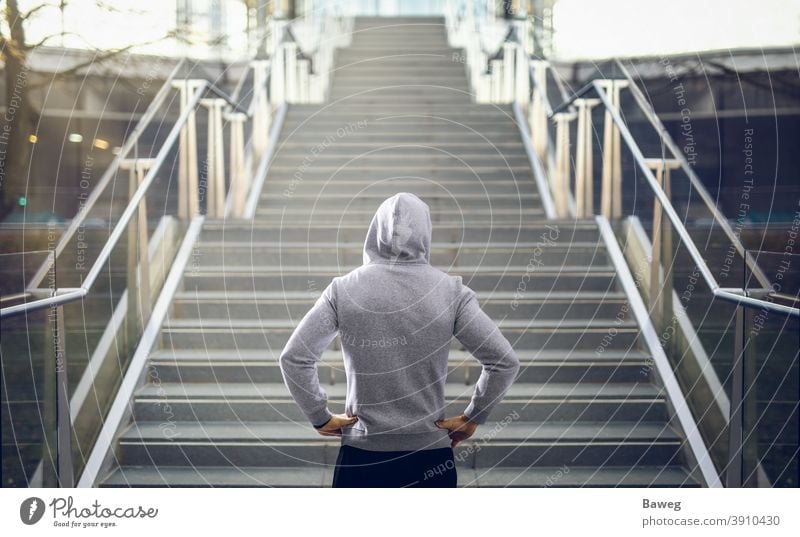 Man in hoodie preparing for stair run. running Stairs Outdoor Hoodie Copy Space Diet Discipline Energy Fitness Health Outside Power Sport Sports Sportswear