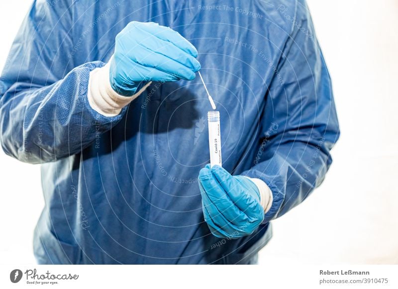 a doctor holds a smear tube with coronavirus in her hand Swab tubes Doctor covid-19 corona vaccination corona vaccine compulsory vaccination Proof Positive