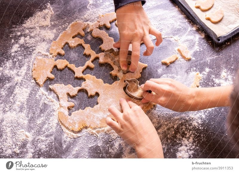Cutting out children at biscuits children's hands Cookie cute Delicious Baking Baked goods Christmas biscuit Christmas & Advent cookie cutter cookie dough