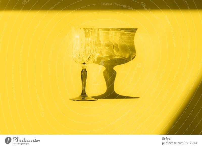 Illuminating yellow flat lay with glass and shadow gray color illuminating grey year ultimate stemmed monochrome minimal drink new year design style geometry