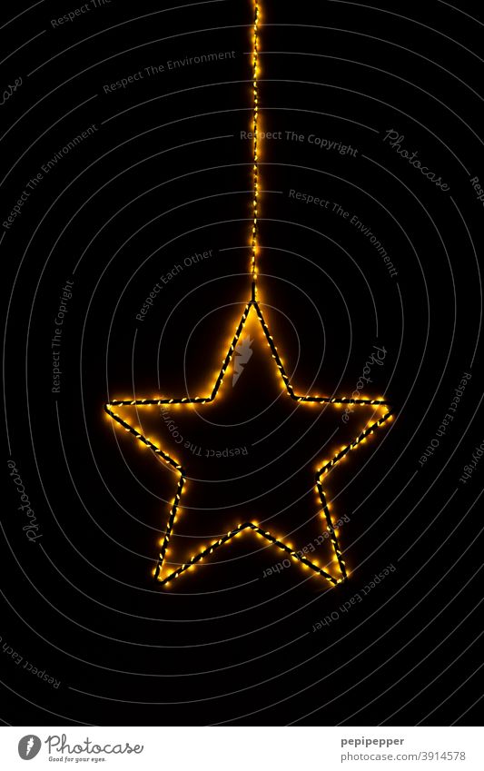 burning star, light chain wrapped around a star Stars Fire Burn Blaze Flame Hot Warmth Christmas & Advent Light Yellow Feasts & Celebrations Dark Ignite