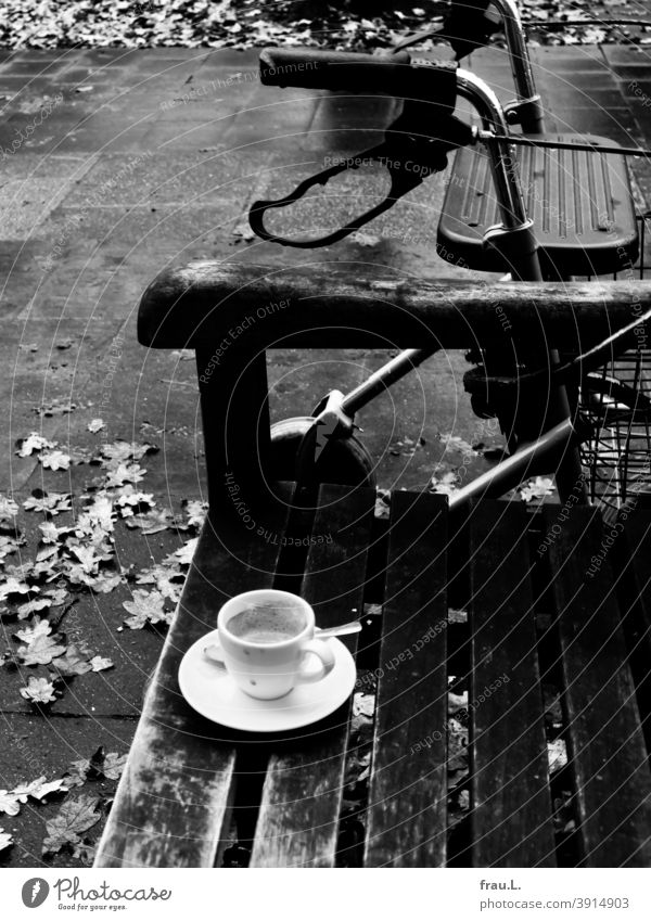 A bench, an espresso cup and a rollator Espresso Café Coffee cup Coffee break Autumn leaves Footpath