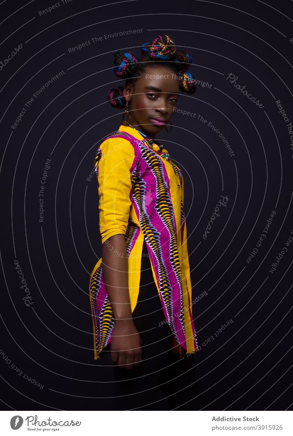 Fashionable black woman in colorful outfit fashion style tradition african garment ethnic bright young female model appearance apparel vivid afro lady vibrant