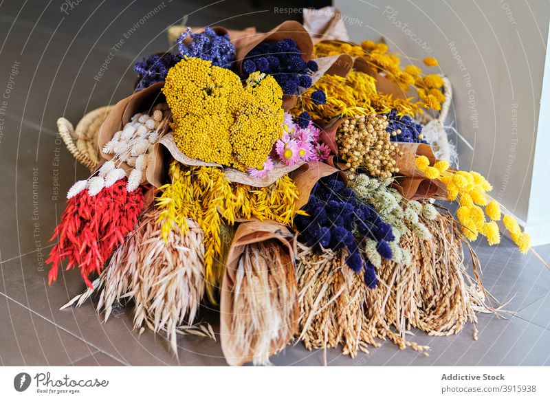 Bunch of various colorful flowers in craft paper bouquet shop bunch assorted dried fresh bloom blossom plant lagurus hare tail grass yarrow lavender spikelet