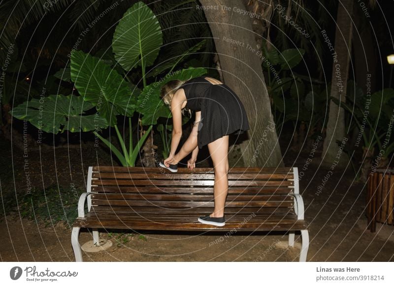 This piece is from a trip to Malaga, Spain. A young blonde girl is trying to tie her shoe in a botanical garden at night. The feeling is that the summer is never going to end during these holidays.