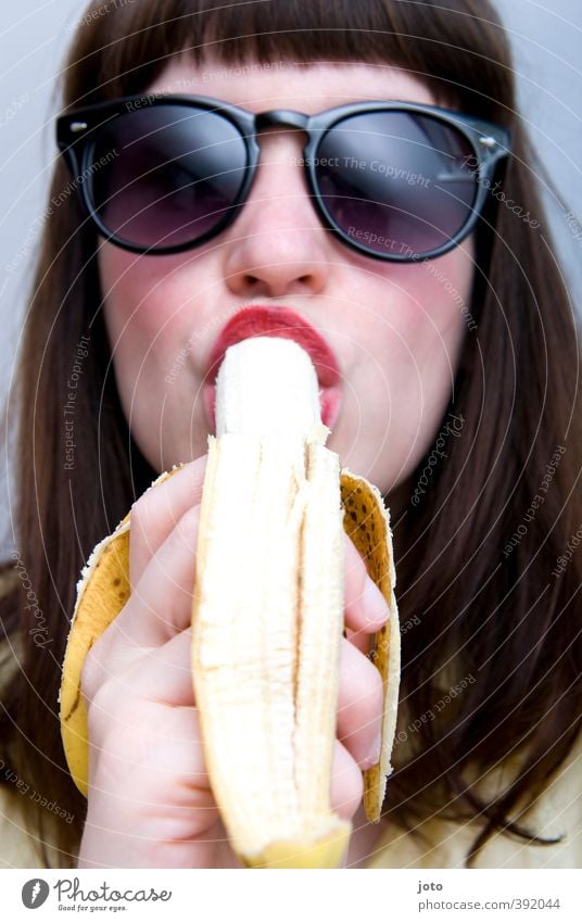 banana Fruit Vegetarian diet Well-being Feminine Young woman Youth (Young adults) Sunglasses Bangs Eating Eroticism Brash Delicious Cool (slang) Lust To enjoy