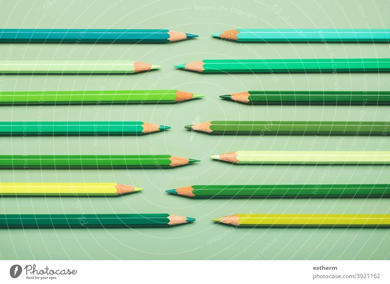 interlocking pencils in green tones color pencils college palette rainbow closeup colorful object concept draw fence row texture wooden multicolor objects craft