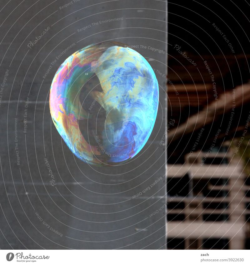 Dreams and soap bubbles Soap bubble Bubble Round Prismatic colors Rainbow Circle Wall (building) Facade Gray variegated Town