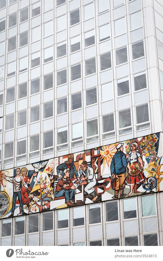 Once in Berlin, Germany. The city is full of great architecture and this piece shows a building with a vintage fresque full of working-class heroes. A moody and grey building is getting back to life with this small accent.