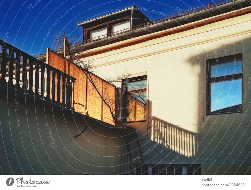 The center of power Exterior shot Colour photo Barrier Fence balustrade Protection House (Residential Structure) Facade Balcony Window Sunlight Shadow