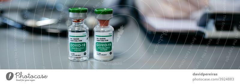 Two vials of coronavirus vaccine vaccine dose covid-19 immunization concept vaccination bottle medical banner web header panorama panoramic