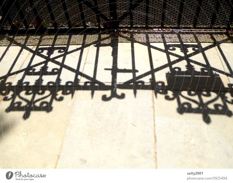 The shadow of the gate... Goal Main gate Entrance Shadow Wrought iron England door Closed Old Front door Structures and shapes Lock Metal Safety Exterior shot