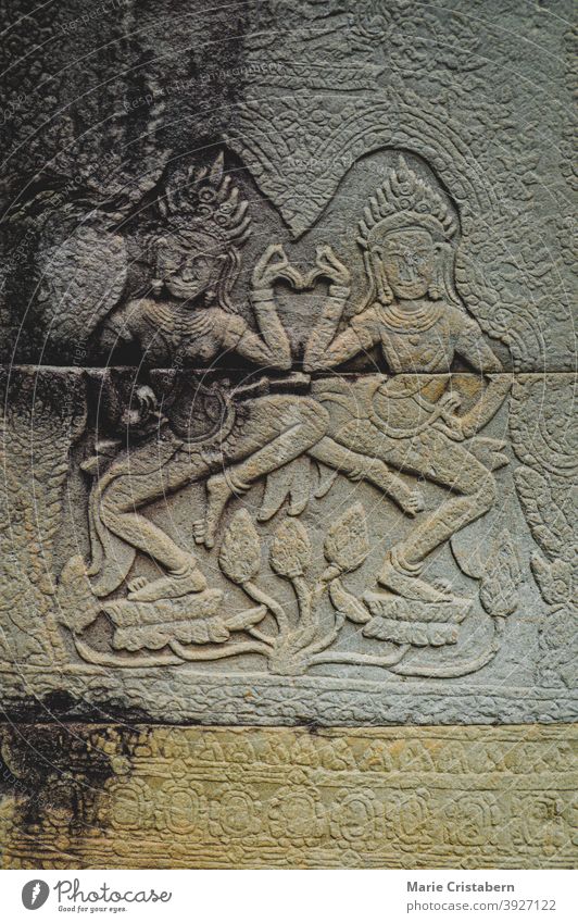 Bas-relief decoration depicting the Apsara Dancers in the walls of Angkor Wat in Cambodia bas-relief apsara dancers angkor wat ancient ruins siem reap cambodia