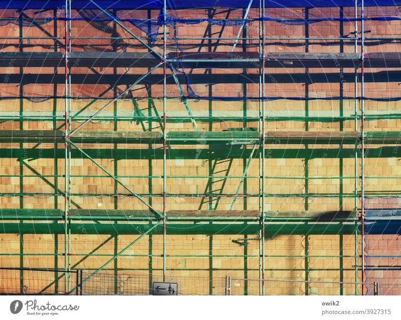 Sprightly Scaffold Building House (Residential Structure) Scaffolding Town Construction site Detail Exterior shot Contrast Sunlight Shadow Light Firm Long shot