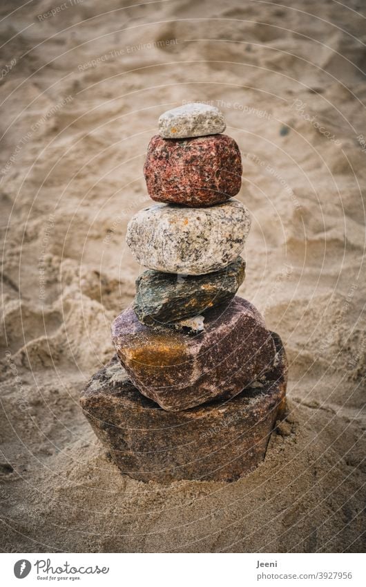 Stones stacked on the beach, harmonious and balanced stones Stack pile stacking Balance Spirituality Ocean Beach coast Sand Sandy beach Meditation harmony