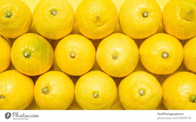 Background of lemons, top view. Yellow pattern with lemons. 2021 above view abstract abundance aligned background bright citrus color detox diet farmers market