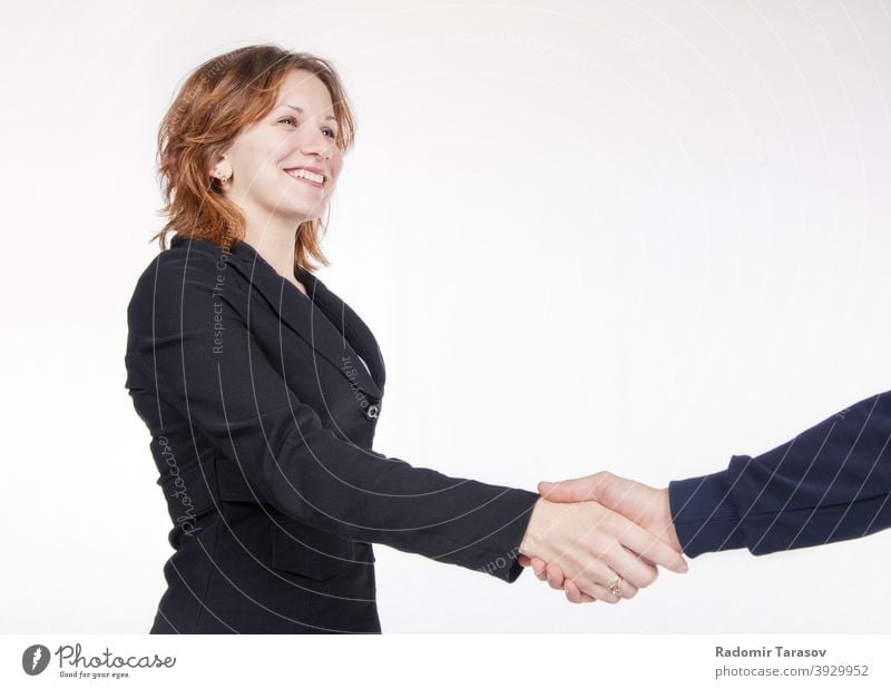 business woman shaking hands with a colleague people agreement office handshake team happy businesswoman male female work professional person teamwork greeting