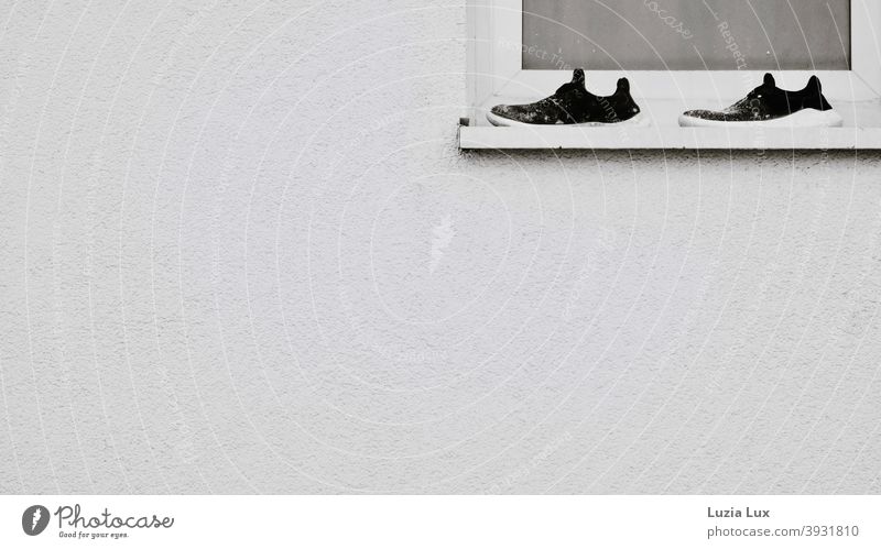 Black and white and nothing else: A pair of sneakers full of stains on a window sill at the top right of the picture Window Windowsill Window board Above Right
