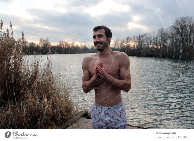 young man in swimming trunks at a lake in winter Man Winter Freeze Young man Lake Cold Naked Upper body Ice bathing hardening Human being Masculine Healthy